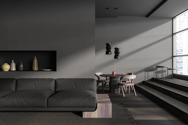 Dark living room interior with sofa and dining table with seats, shelf with decoration. Stairs and panoramic window on skyscrapers. 3D rendering