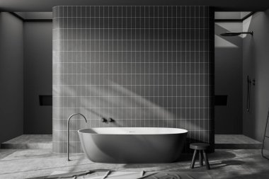 Front view on dark bathroom interior with large bathtub, grey walls, carpet, concrete floor, stool, shower, partition. Concept of water treatment. 3d rendering