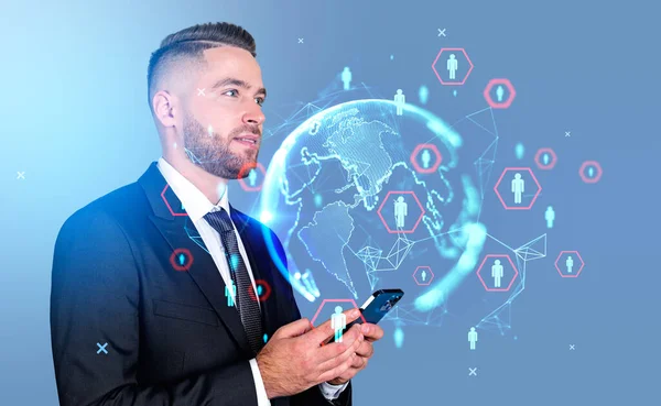 Businessman pensive profile with smartphone. Earth globe hologram, worldwide social network circuit, diverse icons. Concept of connection and social media