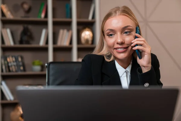 Smiling Businesswoman Talking Phone Working Laptop Computer Office Room Shelf —  Fotos de Stock