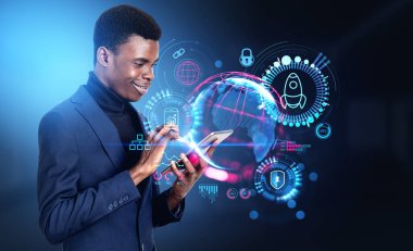 Smiling black businessman finger touch tablet in hand. Earth sphere with worldwide connection hologram hud, rocket launch and digital marketing icons hud. Concept of startup