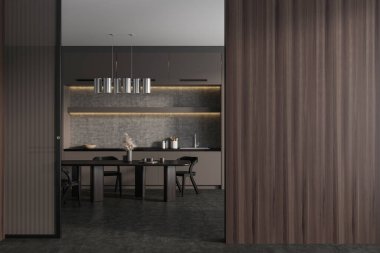 Dark kitchen interior with dining table and chairs, shelves with kitchenware and grey concrete floor. Stylish cooking space. Copy space empty wall. 3D rendering
