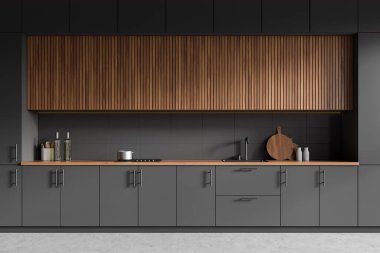 Mutfağın içi lavabo ve ocakla kaplı, mutfak malzemeleri bulaşık ve kesim tahtasıyla dolu. Gri beton zeminde koyu yemek pişirme alanı. 3B görüntüleme