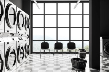 Dark laundry interior with grey washing machines in row, waiting zone with chairs on chess tile floor. Panoramic window on countryside. 3D rendering