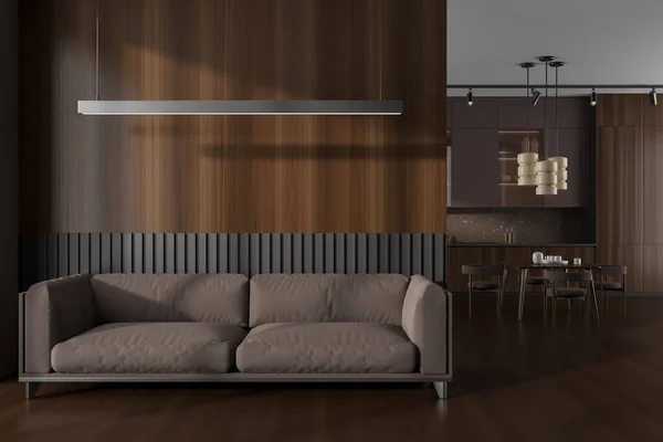 Front view on dark studio room interior with dining table, armchairs, brown wall, oak wooden hardwood floor, cupboard. Concept of minimalist design. 3d rendering