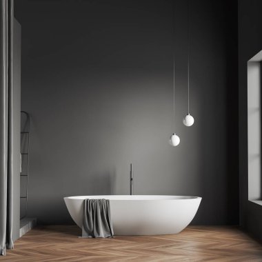Front view on dark bathroom interior with empty grey wall, bathtub, window, towels, oak wooden hardwood floor. 3d rendering