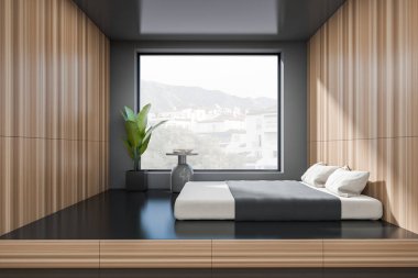 Dark bedroom interior with bed on podium, side view, nightstand with decoration, panoramic window on countryside, black concrete floor. Copy space empty wall. 3D rendering