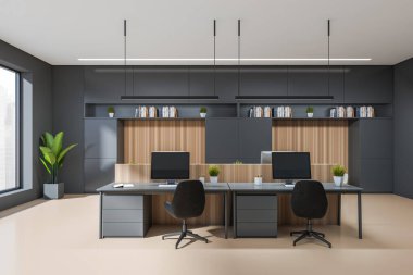 Front view on dark office interior with tables with desktops, panoramic window with Singapore view, shelves with books, concrete floor. Concept of place for working process. 3d rendering