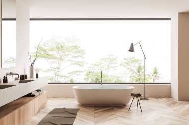 Beige bathroom interior with bathtub and sink with accessories and decor. Bathing area and panoramic window on tropics. 3D rendering