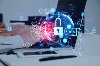 Businessman typing on laptop with digital interface with facial recognition by digital interface with robot face and virtual globe hologram. Concept of modern technology of artificial intelligence