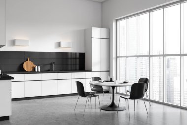 White and black kitchen interior with dining table and chairs, side view shelves with kitchenware on grey concrete floor. Panoramic window on city view. 3D rendering