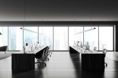 Front view on dark office room interior with computers, desks, armchairs, panoramic window with skyscraper view, wooden floor. Concept of company, firm, meeting space. 3d rendering