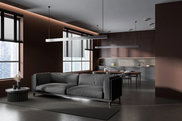 Corner view on dark studio room interior with dining table, armchairs, sofa, cupboard, brown wall, sink, panoramic window, carpet, coffee table. Concept of minimalist design. 3d rendering