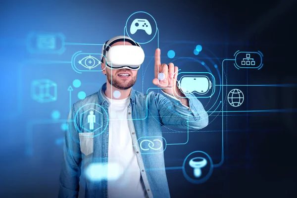 Smiling man in vr headset finger touching cyberspace hologram with glowing icons circuit. Concept of virtual world and immersive technology
