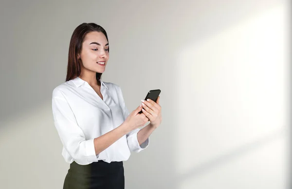 Young Attractive Businesswoman Wearing Formal Wear Standing Holding Smartphone Concrete — 图库照片