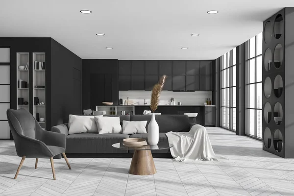 Front view on dark studio room interior with island with barstools, panoramic window sofa, cupboard, shelf with books, grey wall, sink, oak wooden floor. Concept of minimalist design. 3d rendering