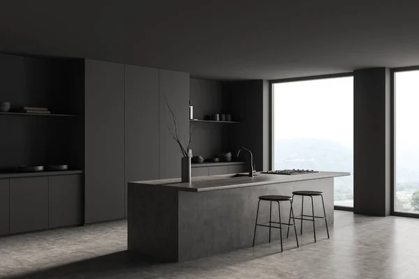Dark kitchen interior with bar chairs and countertop with stove and sink, grey concrete floor. Eating area, side view, panoramic window on countryside. 3D rendering