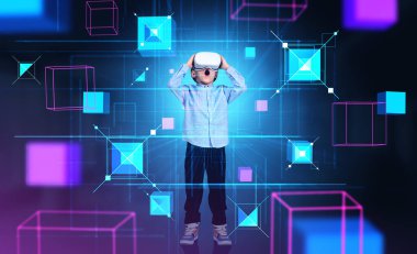 Boy wearing vr headset is watching at metaverse reality with blockchain system touching head. Dark background. Concept of modern technology, progressive currency in business, ambitious children