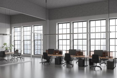 Corner view on dark office room interior with computers, desks, armchairs, panoramic window with skyscraper view, glass partition, concrete floor. Concept of company, firm, meeting space. 3d rendering