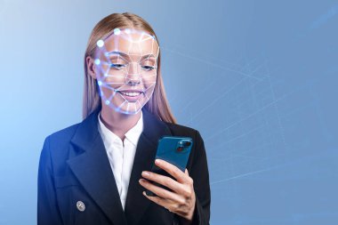 Businesswoman smiling and using phone in hand, biometric scanning and facial recognition. Concept of face id and artificial intelligence