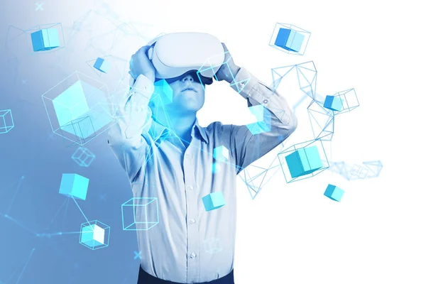 Boy wearing vr headset and formal wear is watching at metaverse reality with blockchain system hologram. Concept of modern technology, progressive currency in business, cyberspace