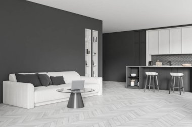 Corner view on dark studio room interior with sofa, coffee table with laptop, cupboard, grey wall, barstools, bookshelf, oak wooden hardwood floor. Concept of minimalist design. 3d rendering