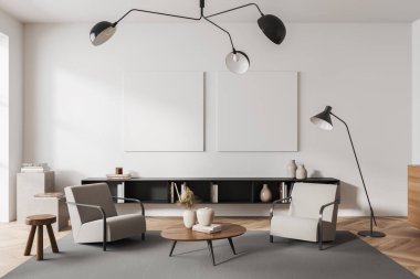 Front view on bright living room interior with two empty white posters, armchairs, coffee table, carpet, bookshelf, oak wooden hardwood floor. Concept of minimalist design. Mock up. 3d rendering