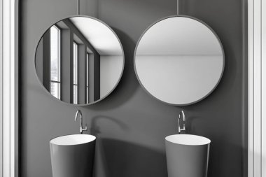 Dark bathroom interior with double sink and two round mirror, window on city view. Stylish washbasin in modern hotel studio. 3D rendering
