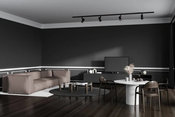 Corner view on dark living room interior with sofa, tv, table with chairs, coffee table, carpet, grey wall, curtain, oak wooden floor. Concept of minimalist design. 3d rendering