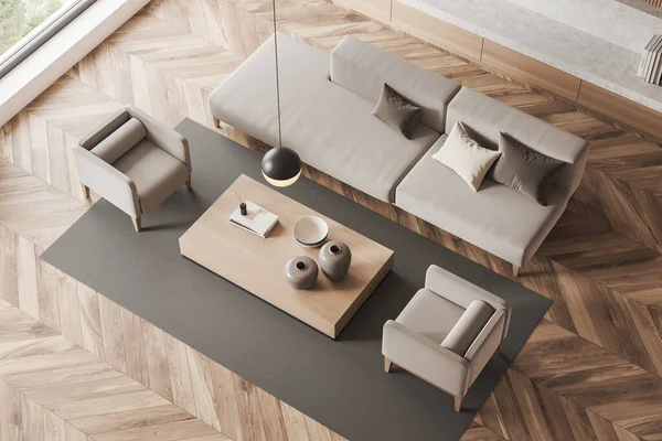 Top view of light lounge zone interior with sofa and two armchairs, coffee table with decoration, carpet on hardwood floor. Window on countryside, 3D rendering