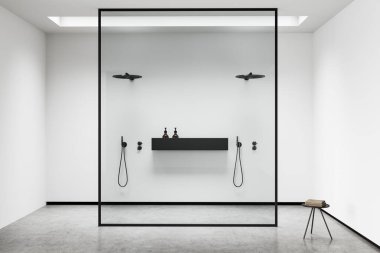 White bathroom interior with double shower behind glass partition, grey concrete floor. Towel table, modern hotel studio, front view. 3D rendering