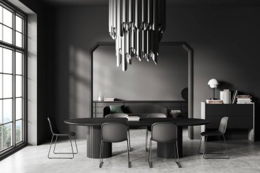 Dark living room interior with dining table and chairs, grey concrete floor. Sofa with drawer and decoration on background. Panoramic window on countryside. 3D rendering