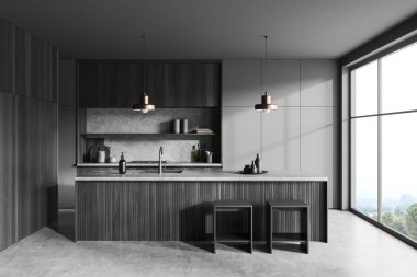 Dark kitchen interior with bar island and chairs, grey concrete floor. Kitchenware on deck, cooking area with panoramic window on countryside. 3D rendering