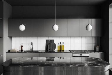 Dark kitchen interior with marble bar countertop, cabinet with sink and stove with kitchenware. Cooking area with concealed design. 3D rendering