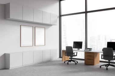 White coworking interior with armchairs and pc computer on desk, side view. Office room with shelves and panoramic window on skyscrapers. Two mockup canvas posters. 3D rendering