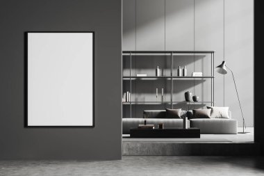 Dark living room interior with sofa and shelf with decoration, podium and carpet on grey concrete floor. Mock up canvas poster on partition. 3D rendering