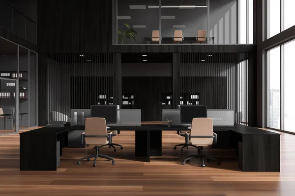 Dark office interior with coworking and conference zone behind glass doors. Two storey office loft with pc computer and panoramic window on skyscrapers. 3D rendering