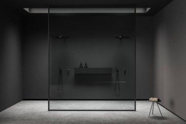Banyo içi koyu renk, cam bölme arkasında çift duş, gri beton zemin. Havlu masası, modern otel stüdyosu, ön manzara. 3B görüntüleme