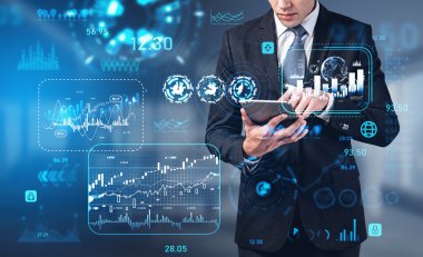 Businessman finger touch tablet in hands. Virtual hud screen with forex diagrams, digital data analysis. Concept of online trading and investment