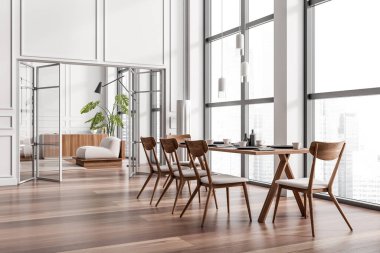 Dining room interior with chairs and dishes on eating table, hardwood floor, side view. Relaxing area on background. Panoramic window on city view. 3D rendering