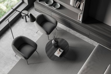 Top view of living room interior with sofa and two armchairs, coffee table and shelf with decoration, concrete floor. Panoramic window on tropics. 3D rendering