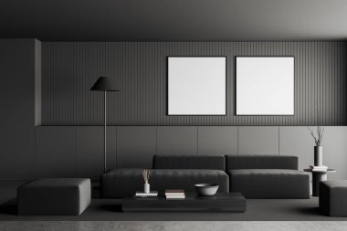 Dark living room interior with sofa and coffee table with decoration, grey concrete floor. Lounge zone with two square mockup frames in row. 3D rendering