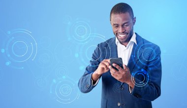 Black businessman working with smartphone, smiling portrait. Digital hologram and circuit of connection in metaverse on blue background. Concept of social media