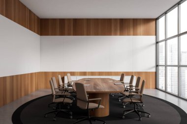 Modern office interior with board and laptop, armchairs on carpet, grey concrete floor. Meeting space with panoramic window on city view. Copy space wall. 3D rendering