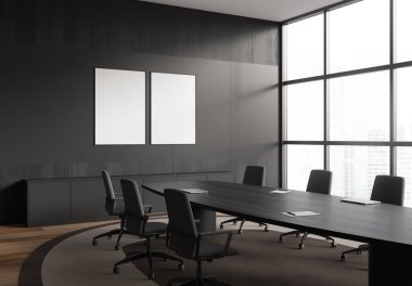 Corner view on dark office room interior with two empty posters, conference board, meeting table, desk, armchairs, panoramic window, wooden floor. Concept of company, firm. Mock up. 3d rendering