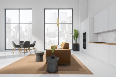 White studio interior with dining table and chairs, sofa and kitchen appliances, side view. Open space kitchen in apartment, panoramic window with New York city view. 3D rendering