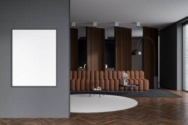 Dark studio interior with sofa and coffee table on carpet. Kitchen with appliances behind partition, window and hardwood floor. Mockup copy space canvas. 3D rendering