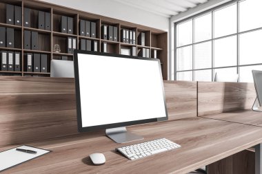 Modern workplace interior with pc computer, side view, wooden desk and shelf with documents. Panoramic window on city view. Mockup blank screen. 3D rendering