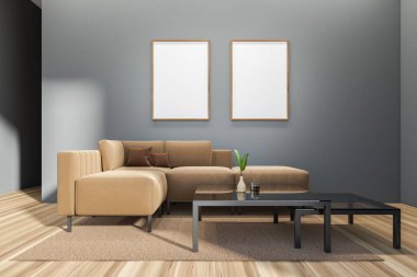 Modern living room interior with sofa on carpet, hardwood floor. Coffee table with reed diffuser and plant. Two mock up posters on grey wall. 3D rendering