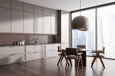 Corner view on dark kitchen room interior with dining table, armchairs, panoramic window, cupboard, grey wall, hardwood floor, electric cooker, sink. Concept of minimalist design. 3d rendering